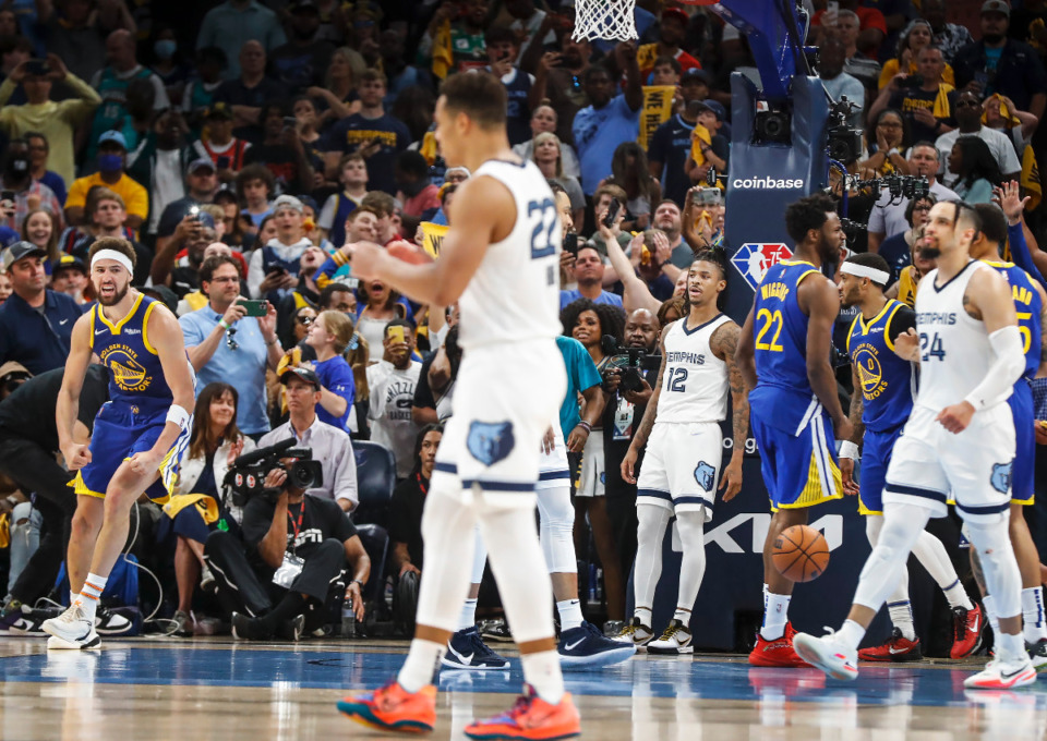 <strong>A dejected Memphis Grizzlies guard Ja Morant (middle) leans against the basket after missing a game-winning shot against the Golden State Warriors on Sunday, May 1, 2022.</strong> (Mark Weber/The Daily Memphian)