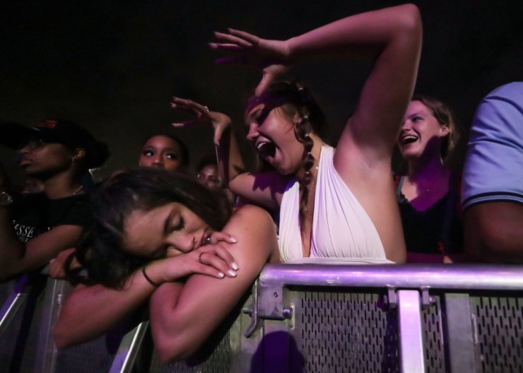 <strong>Isabella Benge teases her friend, Hannah Abu-Khaybeh, who took a nap while waiting on a rain-delayed Megan Thee Stallion at Beale Street Music Fest at Liberty Park April 30, 2022.</strong> (Patrick Lantrip/Daily Memphian)