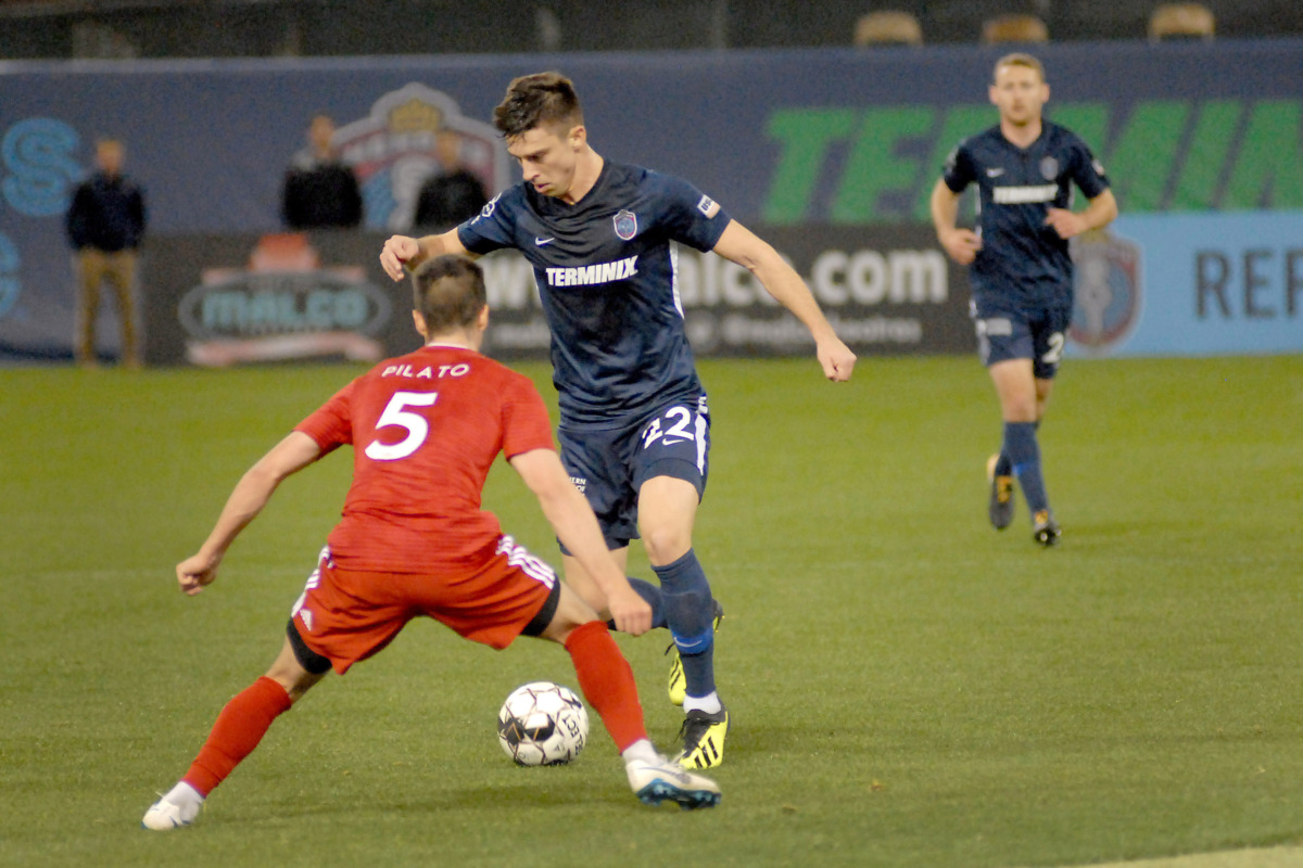 <strong>Memphis 901 FC defender Wes Charpie (#22) works the ball upfield against Noah Pilato (#5) of Loudoun United on Saturday, March 16, 2019, at AutoZone Park in Memphis. The match ended in a 1-1 tie.</strong> (Stan Carroll/Special to The Daily Memphian)
