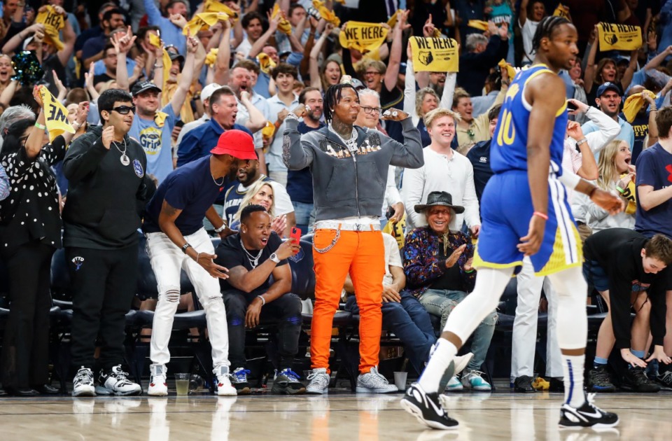 <strong>Memphis Grizzlies fans, including Yo Gotti and Moneybagg Yo (middle) celebrate during action against the Golden State Warriors on Sunday, May 1, 2022.</strong> (Mark Weber/The Daily Memphian)