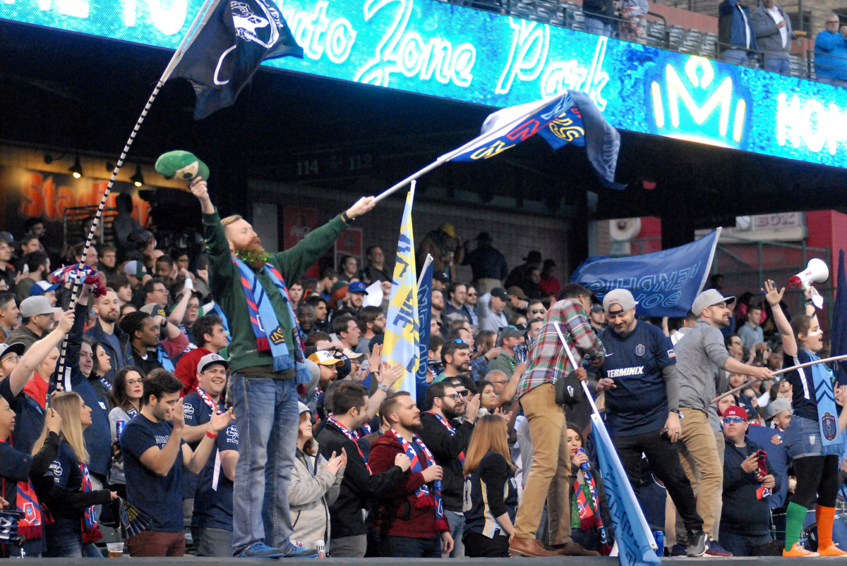 <strong>Bluff City Mafia fans celebrate the start of a match between Memphis 901 FC and Loudoun United on Saturday, March 16, 2019, in AutoZone Park in Memphis. The match ended in a 1-1 tie.</strong> (Stan Carroll/Special to The Daily Memphian)