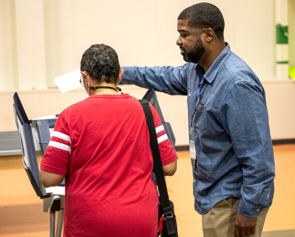 <strong>Bruce Evans instructs Toni M. Wooten about the voting machine at Hope Church on Tuesday, May 3, 2022. Around 50 people had voted at that precinct by noon.</strong> (Greg Campbell/Special to The Daily Memphian)