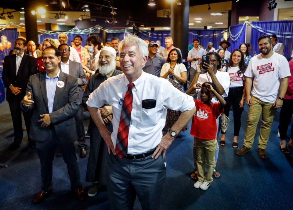 <strong>Shelby County District Attorney Democratic candidate Steve Mulroy (middle) smiles while being introduced during Shelby County Mayor Lee Harris&rsquo; election watch party on Tuesday, May 3, 2022.</strong> (Mark Weber/The Daily Memphian)