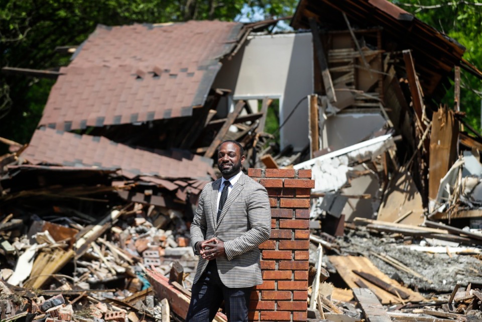 <strong>DeAndre Brown, director of the Office of Reentry, stands in front of a demolished home that will be turned into new transitional housing for ex-offenders next to its office, on Thursday, April 28, 2022.</strong> (Mark Weber/The Daily Memphian)