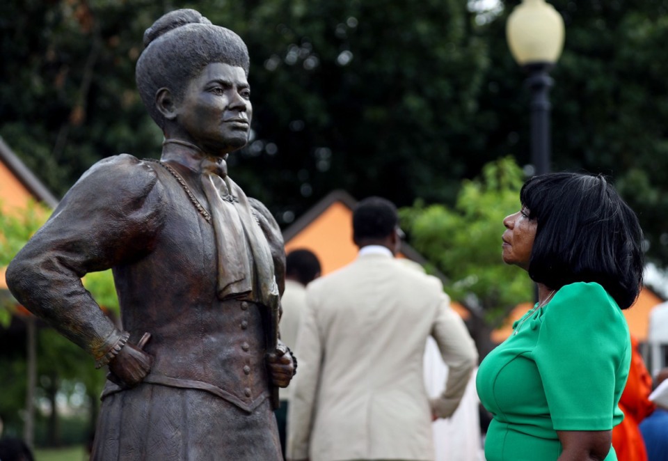 <strong>Ruby Bright has a quiet moment in front of the statue of Ida B. Wells at its unveiling on July 16, 2021, at Fourth and Beale in Memphis.</strong> (Patrick Lantrip/Daily Memphian file)