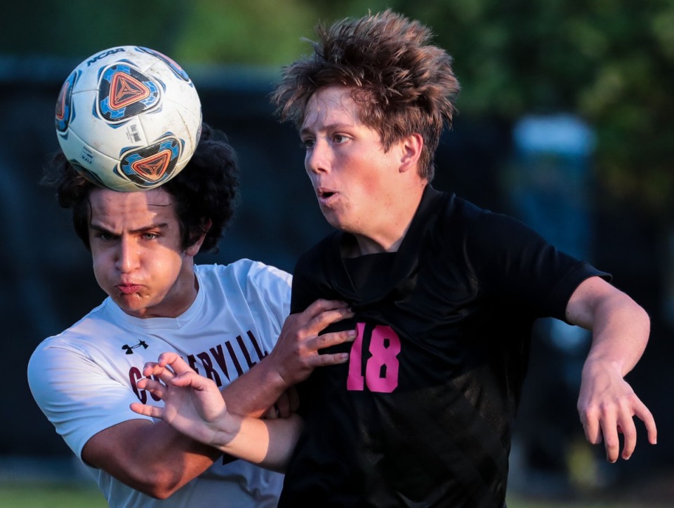 <strong>Houston High School's Dylan Henry (18) and Collierville High School's Ali Amro (2) fight for a loose ball during the May 4, 2022, match.</strong> (Patrick Lantrip/Daily Memphian)