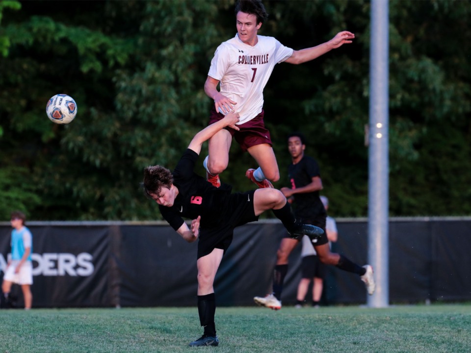 <strong>Collierville midfielder Luke Johnson (7) tries to go over Houston&rsquo;s Jack Langford (6) on May 4.</strong> (Patrick Lantrip/Daily Memphian)