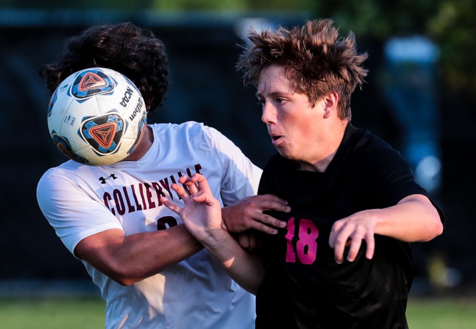 <strong>Houston&rsquo;s Dylan Henry (18) and Collierville&rsquo;s Ali Amro (2) keep an eye out for a loose ball on May 4.</strong> (Patrick Lantrip/Daily Memphian)
