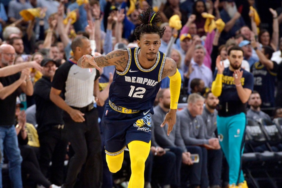 <strong>Memphis Grizzlies guard Ja Morant (12) reacts after scoring during the first half of Game 2 of a second-round NBA basketball playoff series against the Golden State Warriors on Tuesday, May 3, 2022, in Memphis, Tennessee.</strong> (AP Photo/Brandon Dill)