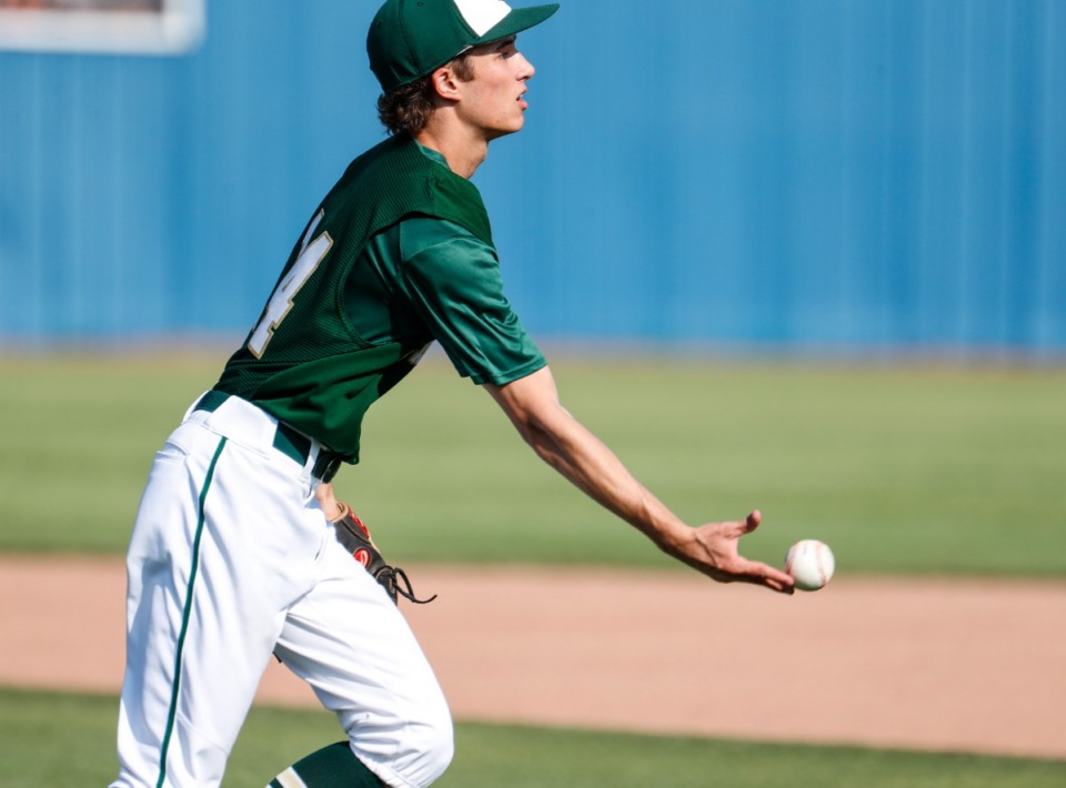<strong>Briarcrest pitcher Jack Gleason lobs to first base to complete the out after fielding the ball in the game against CBHS on Monday, May 9, 2022.</strong> (Mark Weber/The Daily Memphian)