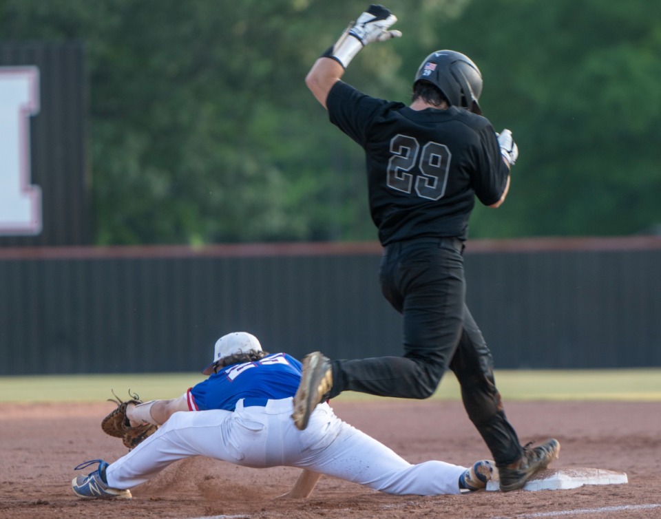 <strong>Houston High School's Jesse Dalton is called out on first thanks to a stretch by Bartlett first baseman C. J. Willis on May 10 at Houston High School.</strong> (Greg Campbell/Special to The Daily Memphian)