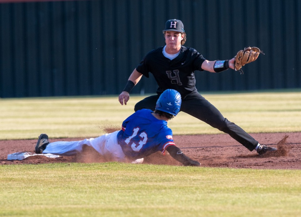 <strong>Bartlett's Jacob Holley slides safe into second as Houston's Tyler Yearwood tries to make the play on May 10.</strong> (Greg Campbell/Special to The Daily Memphian)