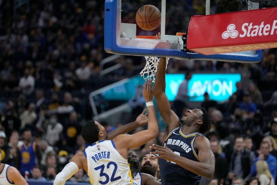 <strong>Memphis Grizzlies forward Jaren Jackson Jr., right, drives to the basket against Golden State Warriors forward Otto Porter Jr. (32) during the second half of Game 4 of an NBA basketball Western Conference playoff semifinal in San Francisco, Monday, May 9, 2022.</strong> (AP Photo/Tony Avelar)