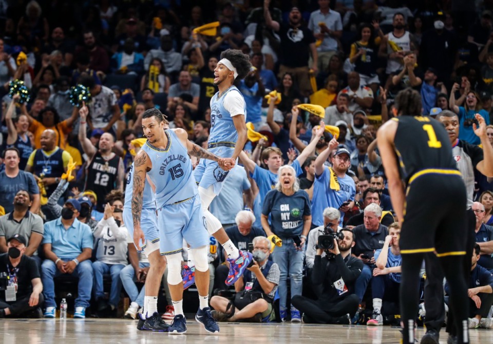 <strong>Memphis Grizzlies forward Ziaire Williams (middle) celebrates beating the Golden State Warriors. There was much whooping of tricks Wednesday night at FedExForum.&nbsp;</strong>(Mark Weber/The Daily Memphian)