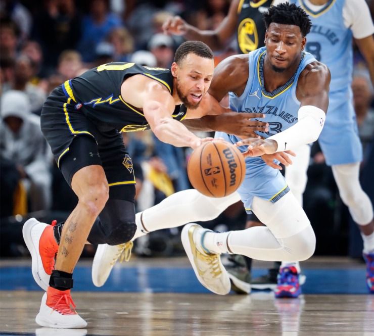 <strong>Memphis Grizzlies defender Jaren Jackson Jr., (right) battles Golden State Warriors guard Stephen Curry (left) for a loose ball during action on Wednesday, May 11, 2022.</strong> (Mark Weber/The Daily Memphian)