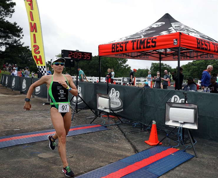 The Memphis in May Triathlon gets underway this weekend at Shelby Farms Park from May 13-14. In this 2019 file photo, local pro triathlete Laura Mathews crosses the finish line. (Patrick Lantrip/Daily Memphian)&nbsp;