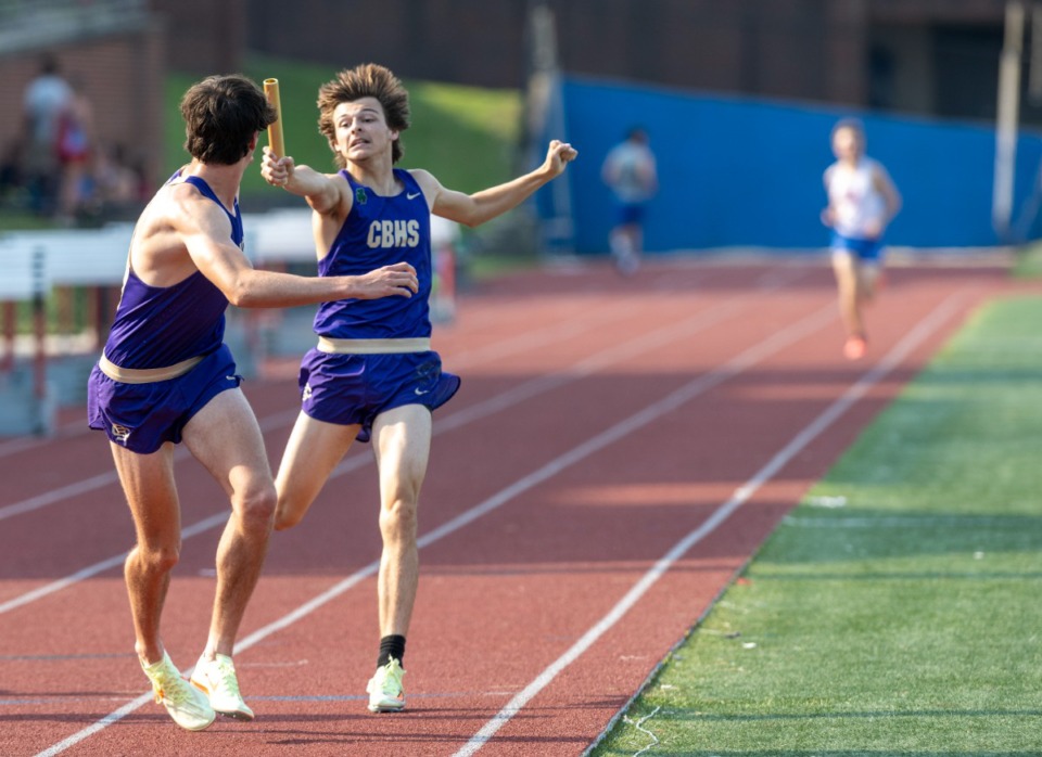 <strong>Chaz Jones hands the baton to CBHS teammate Caleb Walters in the men's 4x800 relay to win the regional at MUS on Thursday, May 12, 2022.</strong> (Greg Campbell/Special to The Daily Memphian)