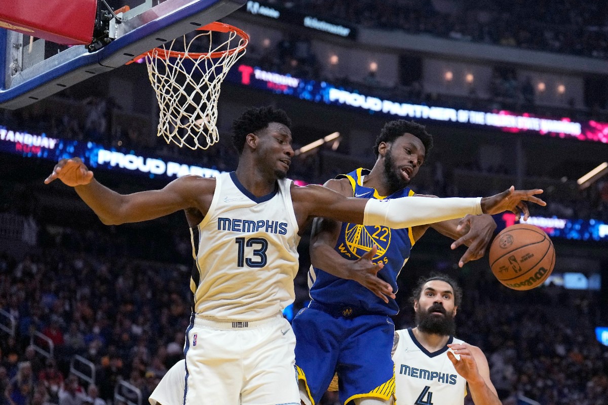 <strong>Golden State Warriors forward Andrew Wiggins (22) and Memphis Grizzlies forward Jaren Jackson Jr. (13) vie for a rebound during Game 6 on May 13, 2022.</strong> (Tony Avelar/AP)