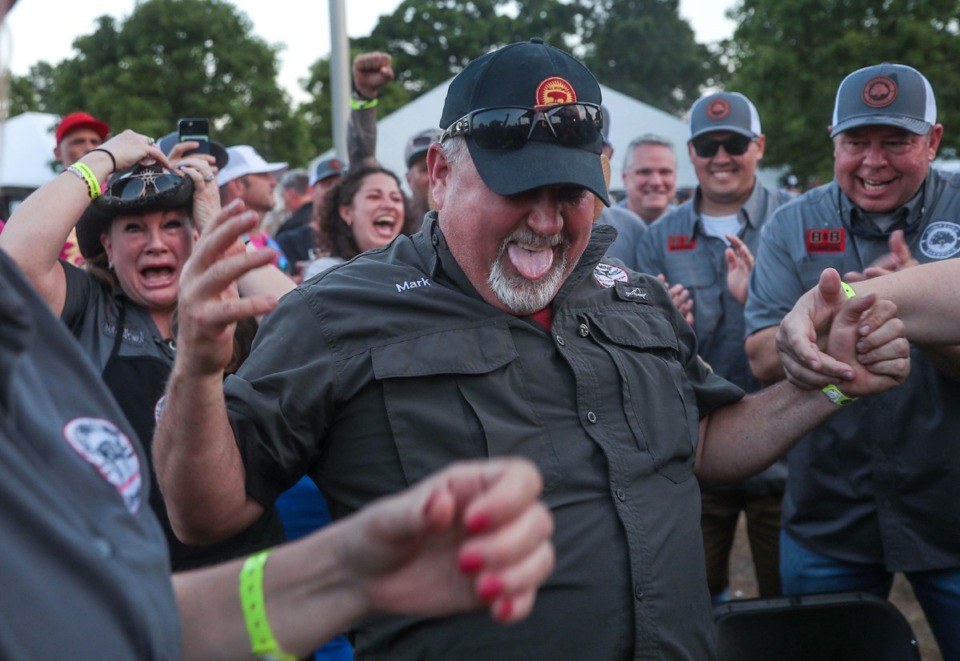 <strong>Members of the Cool Smoke team react to winning second place in the shoulder category during the last day of the Memphis in May World Championship Barbecue Cooking Contest.</strong> (Patrick Lantrip/Daily Memphian)