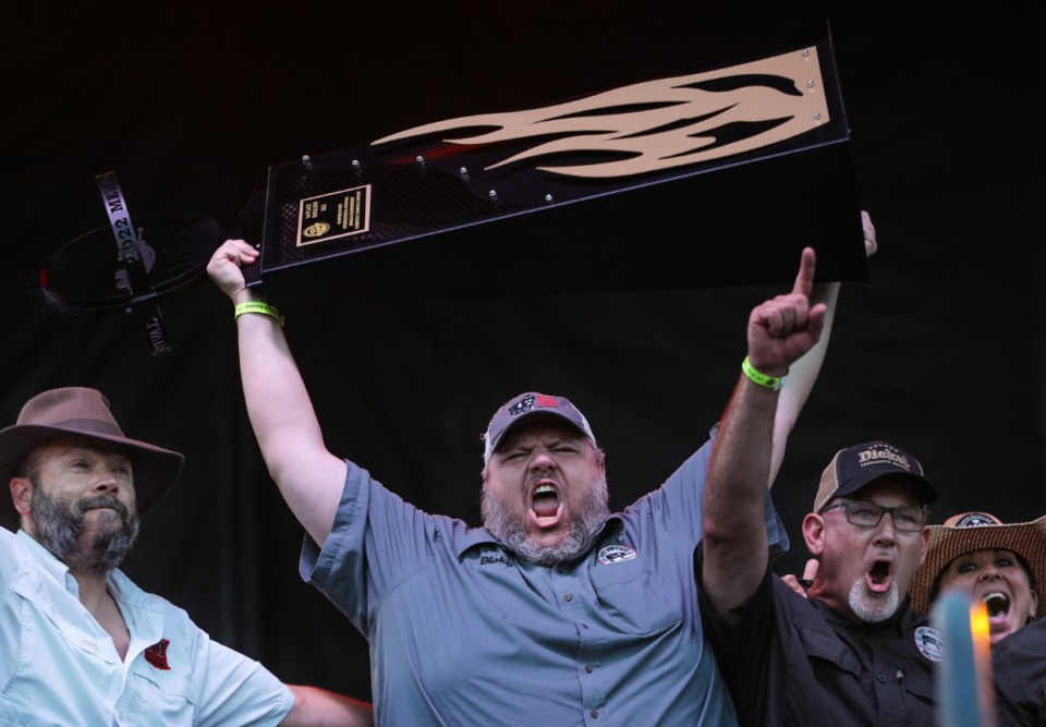<strong>Members of the Memphis-based Sweet Swine O&rsquo; Mine team celebrate winning the shoulder competition Saturday.</strong> (Patrick Lantrip/Daily Memphian)