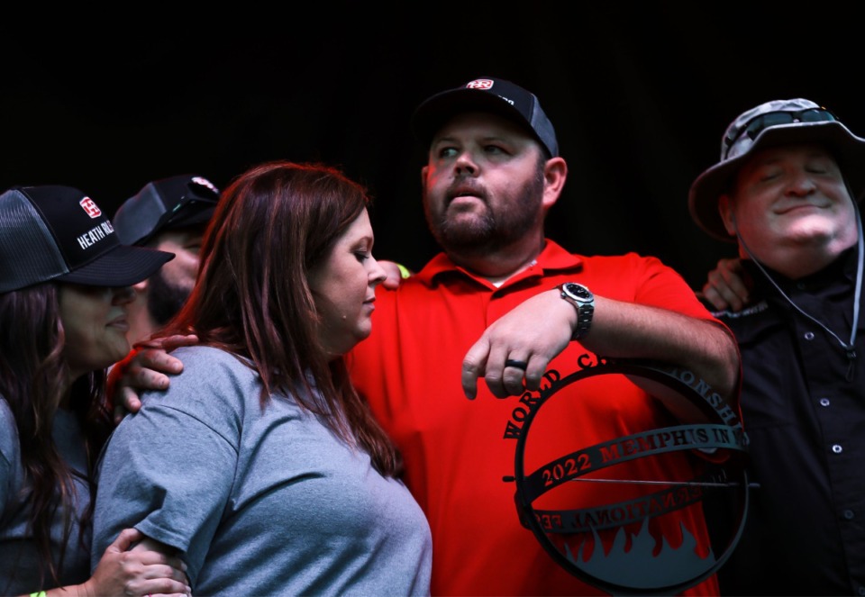 <strong>Members of the Heath Riles BBQ team, which won first place in the ribs division look on anxiously while waiting on the grand champion to be announced.</strong> (Patrick Lantrip/Daily Memphian)