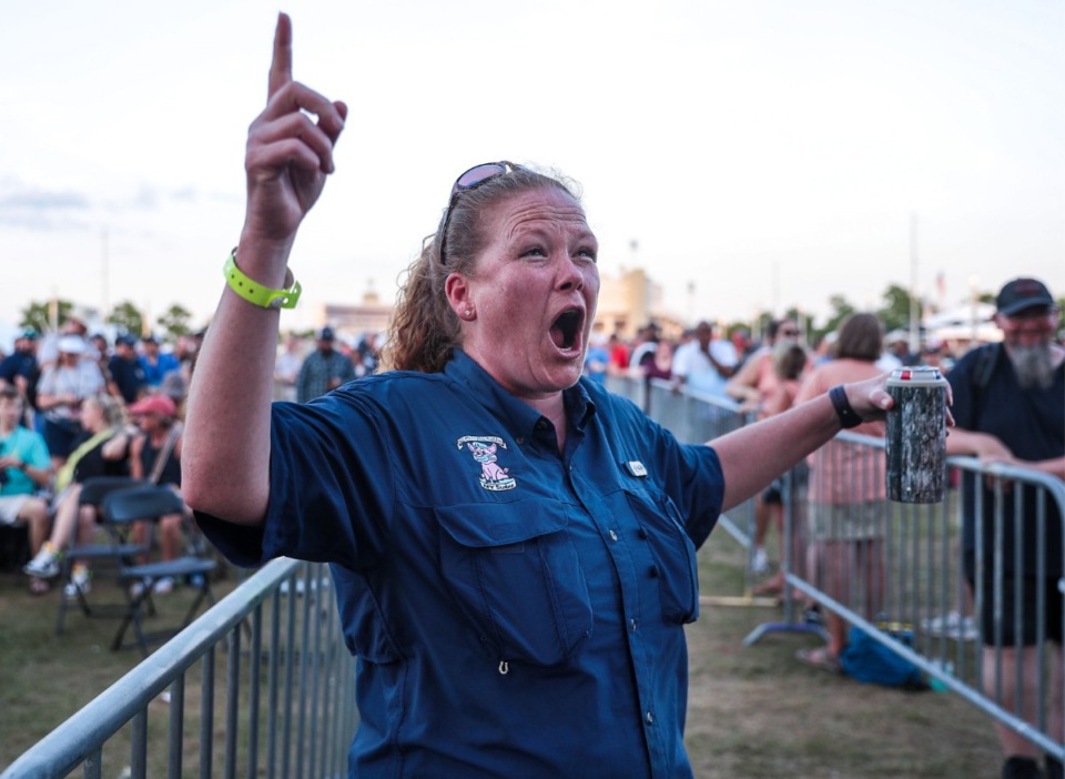 <strong>Melodie Barmer cheers on her teammates with the My Swine tent after a ninth-place finish in the shoulder competition.</strong> (Patrick Lantrip/Daily Memphian)