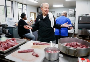 <strong>Volunteer Dimitri Taras cuts pork cubes for skewers on Wednesday, May 18, 2022, while preparing for this weekend&rsquo;s Memphis Greek Festival.</strong> (Mark Weber/The Daily Memphian)