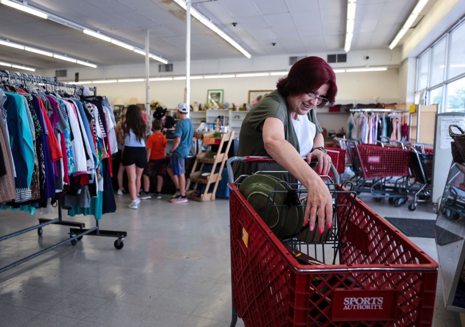 <strong>Theresa Wilson shops for purses at the House of Grace thrift store in Southaven, Mississippi May 17, 2022.</strong> (Patrick Lantrip/Daily Memphian)