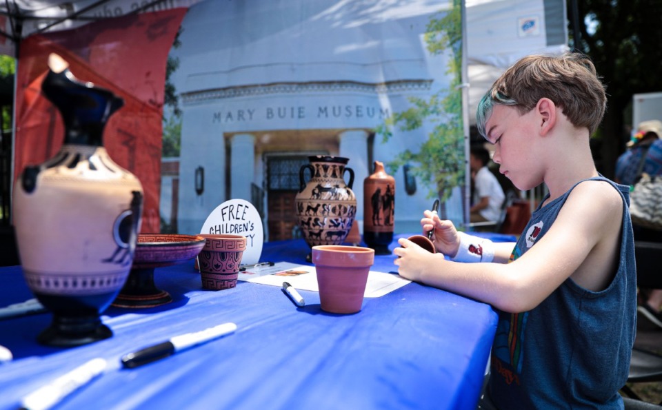 <strong>Eight-year-old Cameron Stephen makes his own Greek vase at Memphis Greek Festival on May 20, 2022.</strong> (Patrick Lantrip/Daily Memphian)