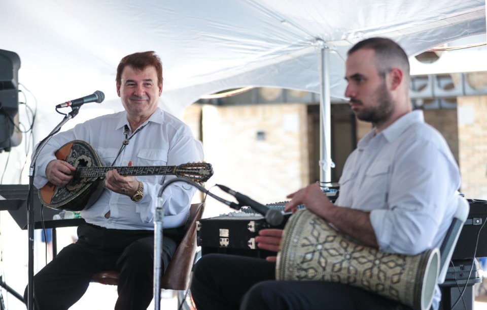 <strong>Kostas Kastanis (left) and his son, George, perform at Memphis Greek Festival on May 20, 2022.</strong> (Patrick Lantrip/Daily Memphian)