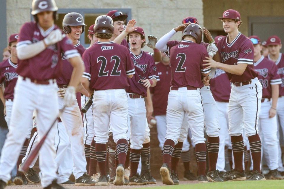 <strong>Collierville players celebrate during the game against the Henry County Patriots on Friday, May 20, 2022.</strong> (Justin Ford/ Special to The Daily Memphian)