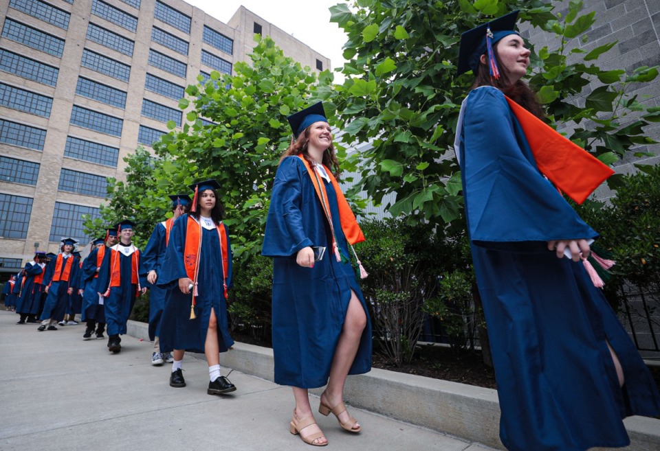 <strong>Crosstown High seniors walk into the gum just before the school's first-ever graduation ceremony May 21, 2022.</strong> (Patrick Lantrip/Daily Memphian)