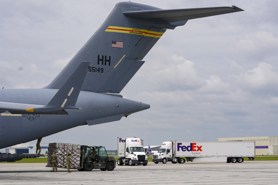 <strong>Pallets of baby formula are transferred to a truck after arriving on an Air Force C-17 in Indianapolis, Sunday, May 22, 2022. The 132 pallets of Nestl&eacute; Health Science Alfamino Infant and Alfamino Junior formula arrived from Ramstein Air Base in Germany.</strong> (AP Photo/Michael Conroy)