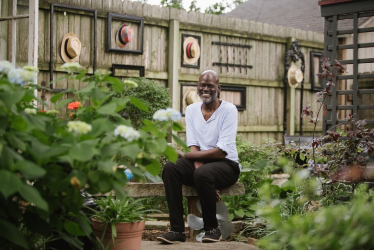 <strong>Christopher Harris decorated his fence to fit the Cooper-Young Garden Walk&rsquo;s &ldquo;hats&rdquo; theme. He said he&rsquo;s lived in the house for 5&frac12;&nbsp;years. "I stand back and look at it and think, &lsquo;I did that&rsquo; and I'm proud of every aspect of it.&rdquo;</strong> (Lucy Garrett/Special to The Daily Memphian)