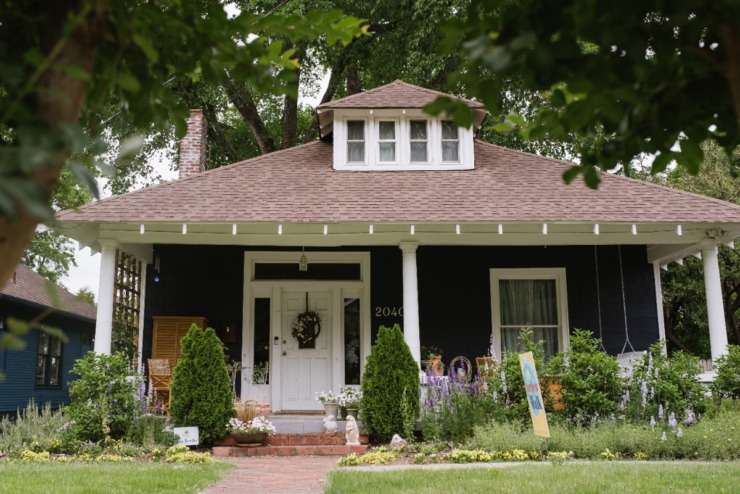 <strong>A bungalow features wildflowers in the front beds.</strong> (Lucy Garrett/Special to The Daily Memphian)
