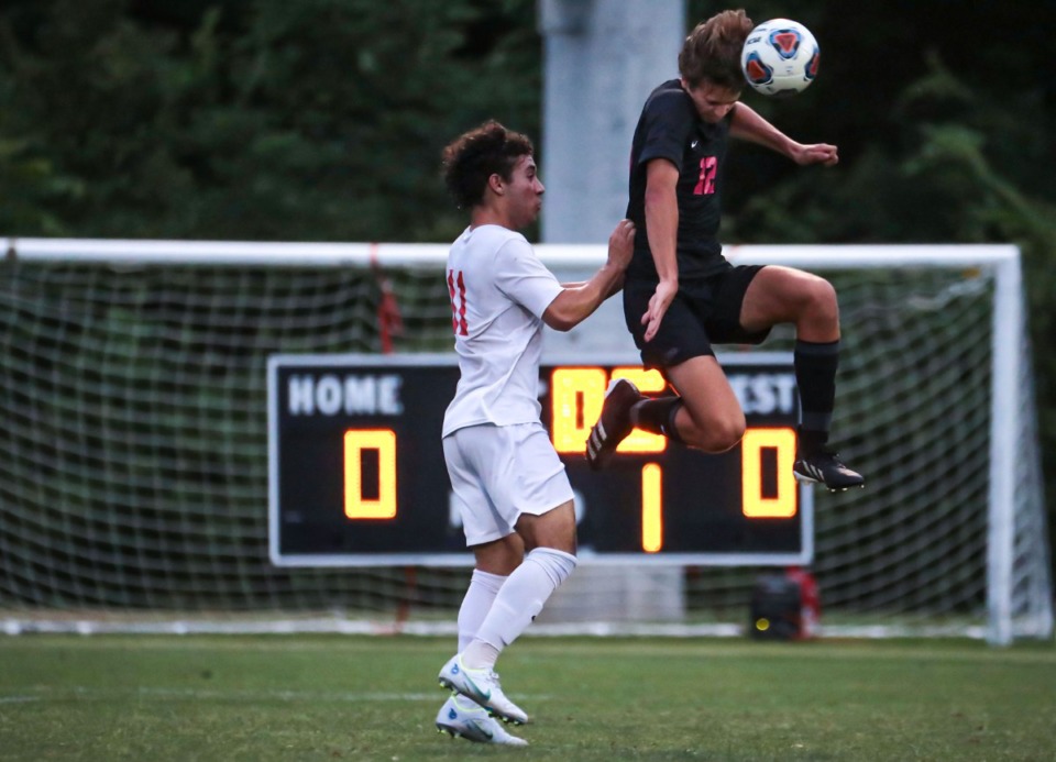 <strong>Houston sophomore Sil Rottink (12) goes for a header during the state championship tournament match against Oakland on May 24 in Murfreesboro, Tennessee.</strong> (Patrick Lantrip/Daily Memphian)