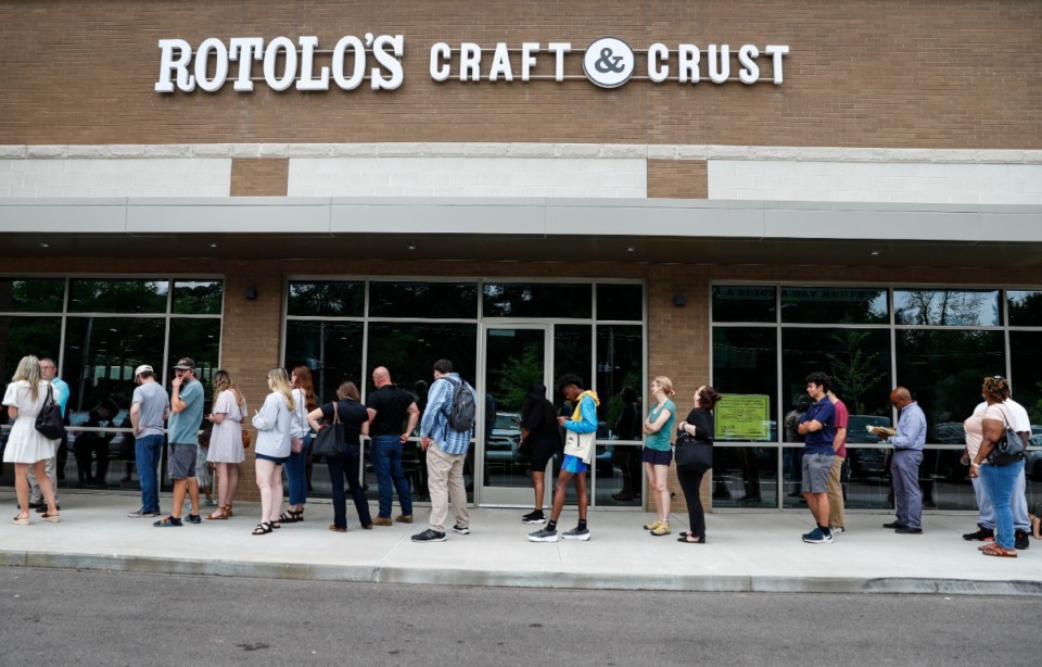 <strong>Customers line up outside the new Rotolo's Craft &amp; Crust on Tuesday, May 24, 2022.</strong> (Mark Weber/The Daily Memphian)