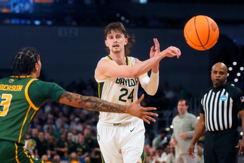 <strong>Baylor guard Matthew Mayer (24) passes off against Norfolk State guard Daryl Anderson (13) during the first half of a college basketball game in the first round of the NCAA tournament in Fort Worth, Texas, Thursday, March 17, 2022.</strong> (AP Photo/LM Otero)