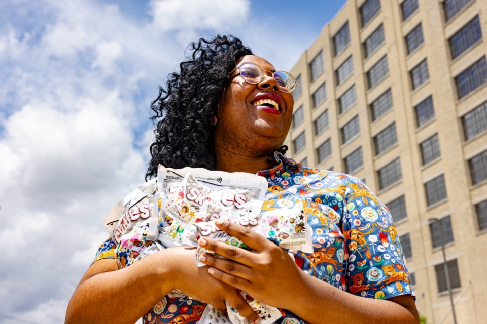 <strong>Memphis artist Mia Saine (in front of Crosstown Concourse) is working with two national brands, Crocs and Skittles, to recognize Mental Health Awareness month in May as well as to showcase the talents of the LGBTQ community during Pride Month in June.</strong> (Ziggy Mack/Special to The Daily Memphian)