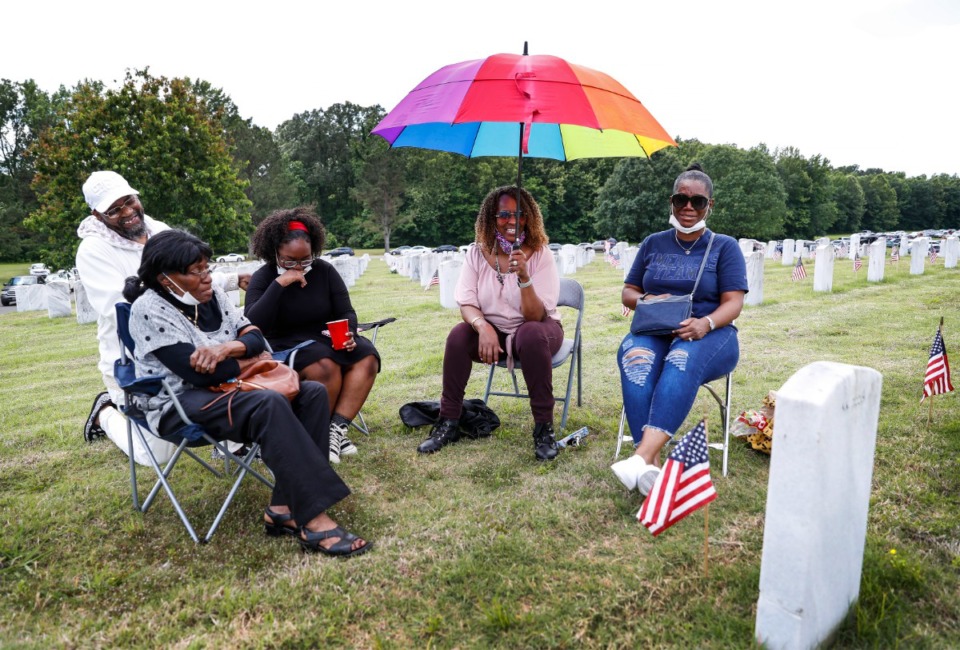 <strong>The family of Army PVT Harold Thomas&rsquo; celebrates his life while telling stories as they sit at this gravesite on Memorial Day, Monday, May 30, 2022 at the West Tennessee State Veterans Cemetery. (Mark Weber/The Daily Memphian)</strong>