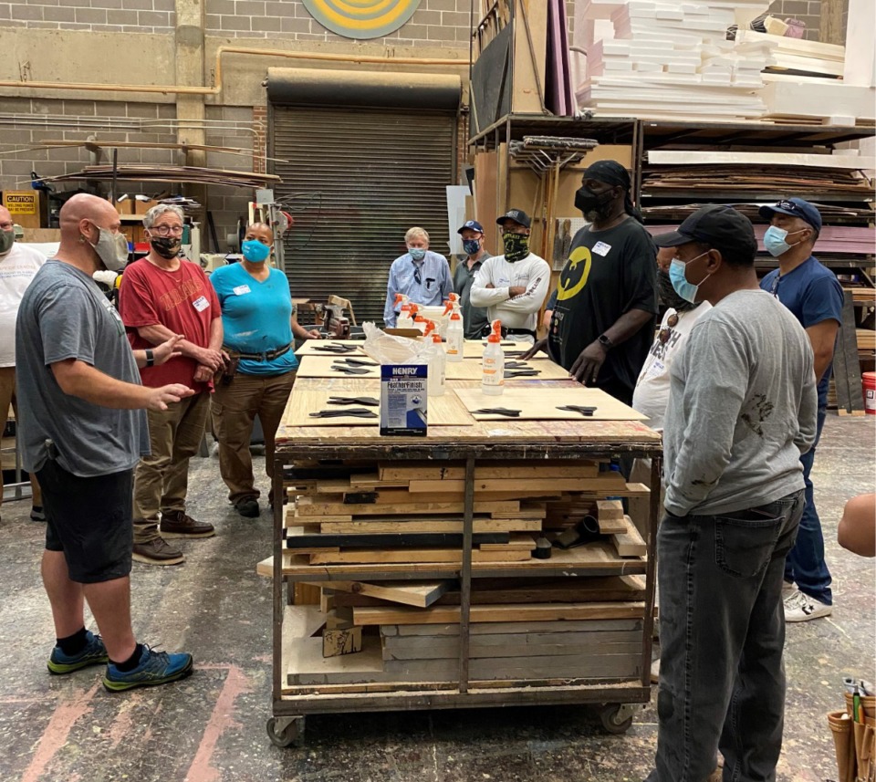 <strong>Industry Scenic Painter Eddie Nichols (far left) talks the finer points of painting sets during a Memphis &amp; Shelby County Film Commission painting workshop held summer 2021. The commission will hold its next workshop in June.</strong> (Memphis &amp; Shelby County Tv/Film Commission)