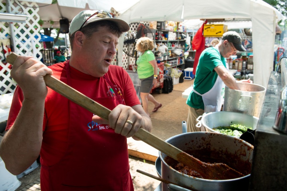 <strong>"Oliveus" members Scott Brown, left, and Steve Landwehr work on their team's Italian gravy sauce for competition during the 30th annual Memphis Italian Festival. The festival will return on Thursday, June 2.</strong> (Brandon Dill/Special To The Daily Memphian)