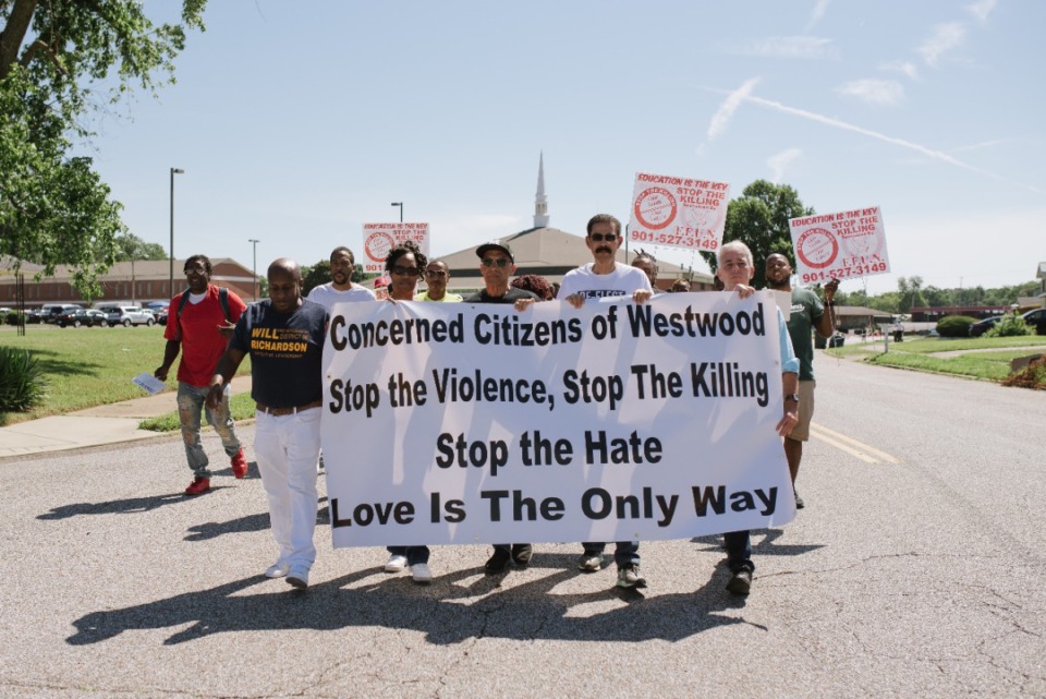 <strong>Members of the community and elected officials hold the sign for the&nbsp;Love and Peace Unity Walk Against Gun Deaths on Saturday, June 4, 2022.</strong>&nbsp;(Lucy Garrett/Special to the Daily Memphian).