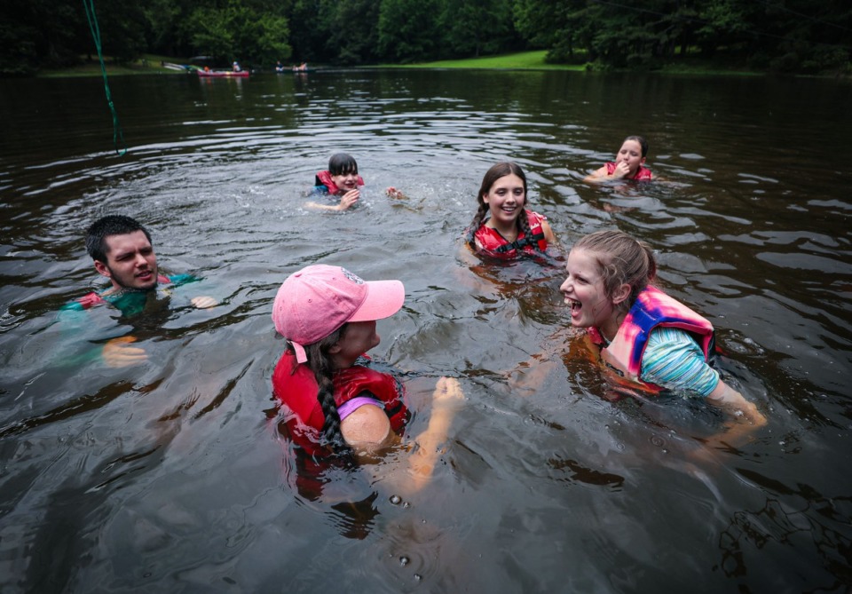<strong>Camp Able participants play in the lake at St. Columba in Bartlett. </strong>(Patrick Lantrip/The Daily Memphian)