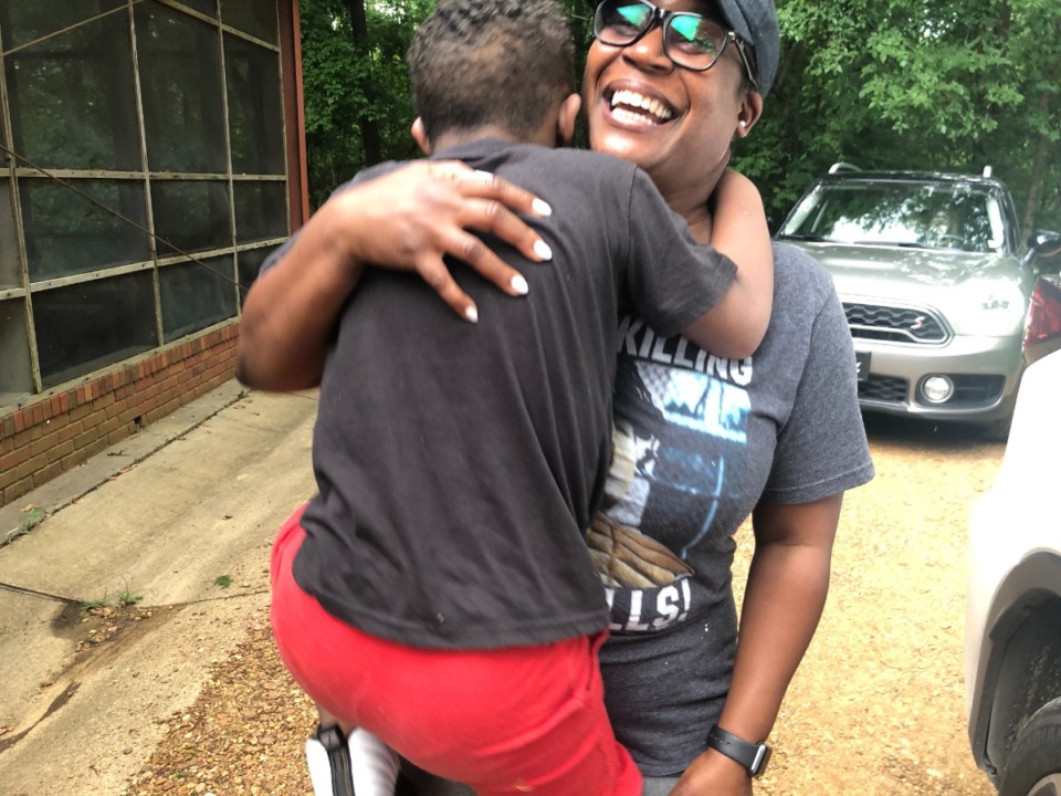 <strong>Shonda Keys greets her son at the end of a day of activity at Camp Able. &ldquo;This camp is made especially for him, for kids like him. It&rsquo;s so diverse &mdash; age, ability, gender. I couldn&rsquo;t be more thankful.&rdquo;</strong> (Jane Roberts/The Daily Memphian)