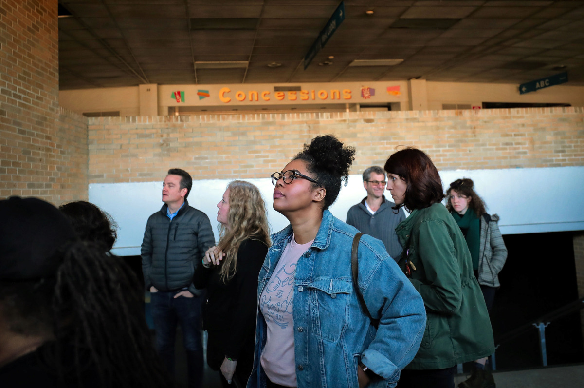<strong>Sheree Stubblefield (center) with the Cooper Young Community Association looks around one of the entryways with other interested Memphians during a tour of the Mid-South Coliseum on March 22, 2019, conducted by the Coliseum Coalition to educate members of the public on the site&rsquo;s history, present condition and the possibilities of development in the future.</strong> (Jim Weber/Daily Memphian)