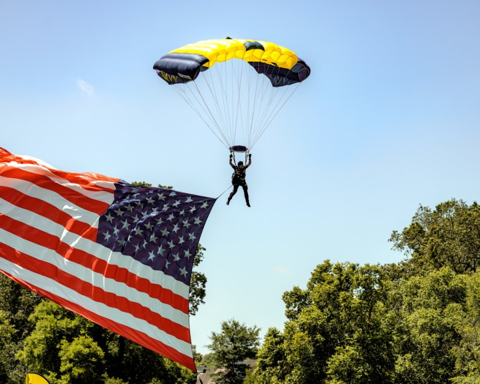 <strong>The Navy's parachute team, the Leap Frogs, landed on the lawn of the Museum of Science and History on June 16, 2022.</strong> (Houston Cofield/Special To The Daily Memphian)