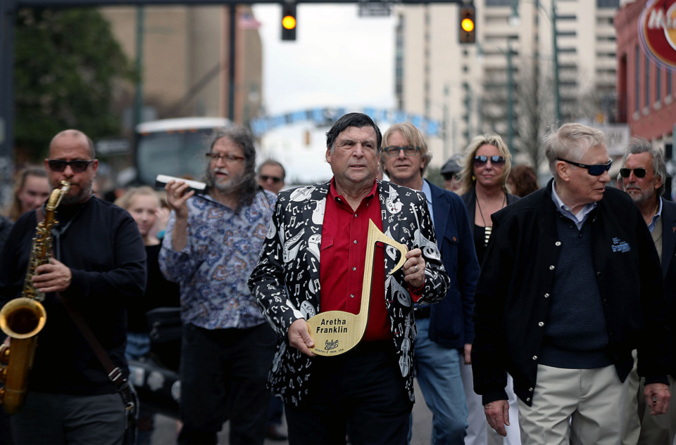 <strong>Dean Deyo, chairman of the Beale Street Walk of Fame, leads a second line procession down Beale Street Sunday, March 24, in honor of Memphis-born Aretha Franklin. The Queen of Soul, who died last August,&nbsp; received a posthumous spot on the Beale Street Walk of Fame.</strong> (Patrick Lantrip/Daily Memphian)