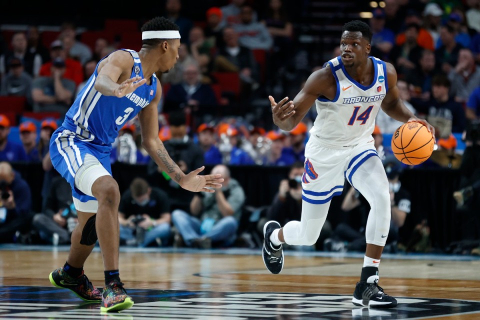 <strong>Boise State guard Emmanuel Akot (14)&nbsp; drives past Memphis guard Landers Nolley II (3) during the first half of a first round NCAA college basketball tournament game, Thursday, March 17, 2022, in Portland, Ore.</strong> (AP file photo/Craig Mitchelldyer)