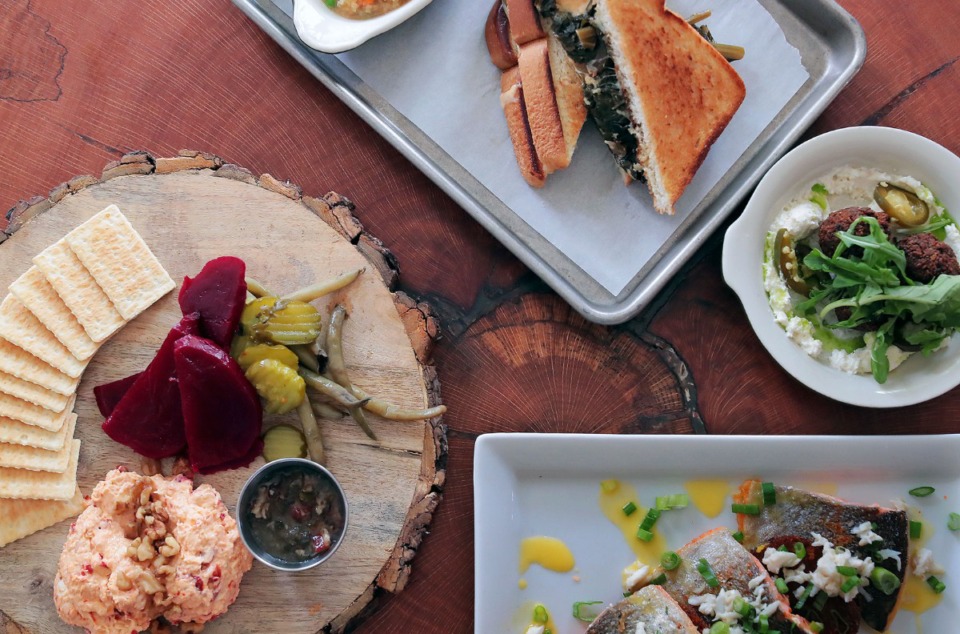 <strong>When Magnolia &amp; May opened, the menu included Not The Grove Grill's Pimento Cheese (clockwise from left), Saut&eacute;ed Rainbow Trout, Black Eyed Pea Falafel, and Collard Green Melt.</strong> (Patrick Lantrip/Daily Memphian file)